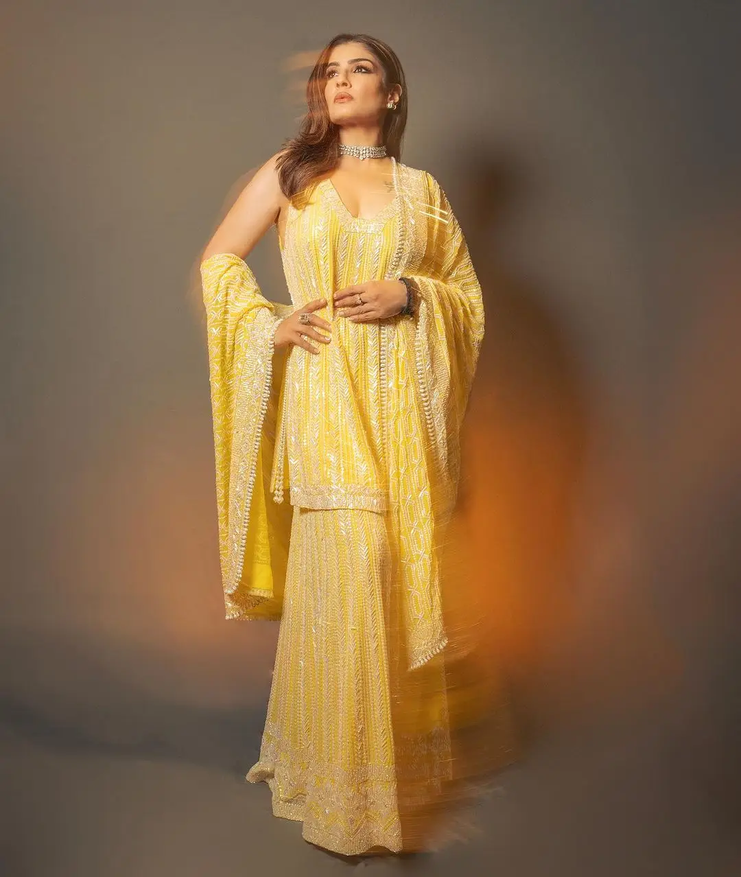 Raveena Tandon Wearing Beautiful Earring Yellow Gown